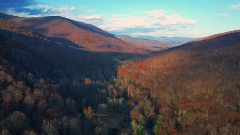 aerial drone video footage of the magical, beautiful appalachian mountains during fall autumn with beautiful golden light and skies