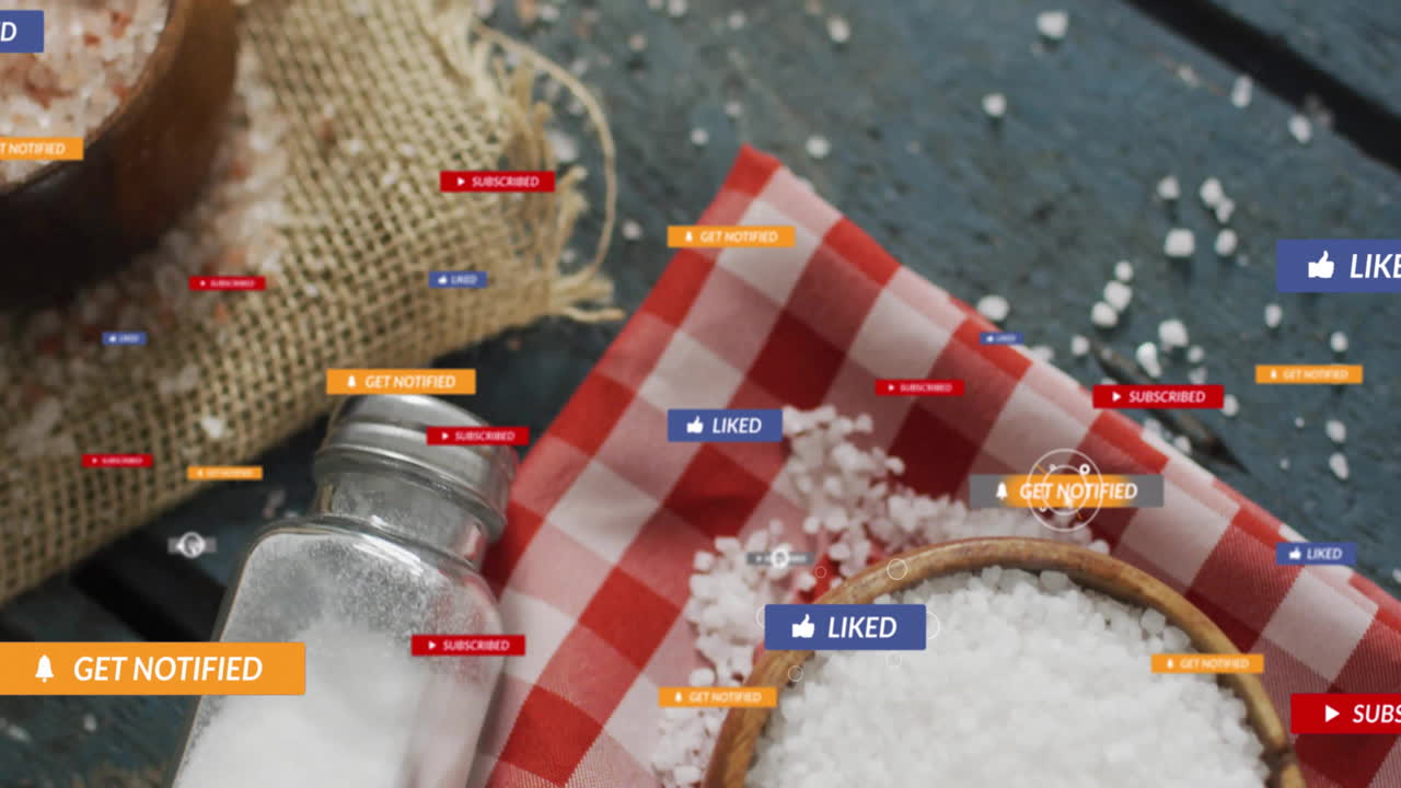 Salt shaker and bowl on checkered cloth with animation of social media notifications