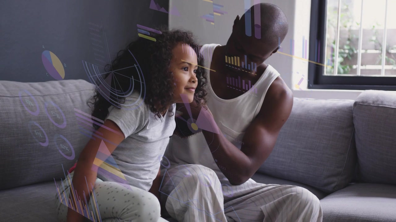 Dad reaching toward girl's hair, styling for care on sofa as motion charts appear showing health