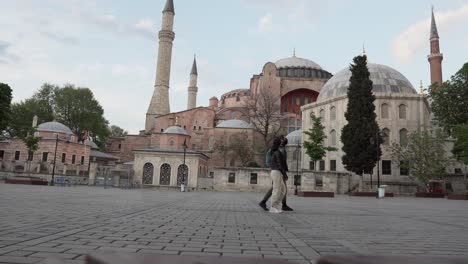 tourist couple walking near hagia sophia in covid19 quarantine time