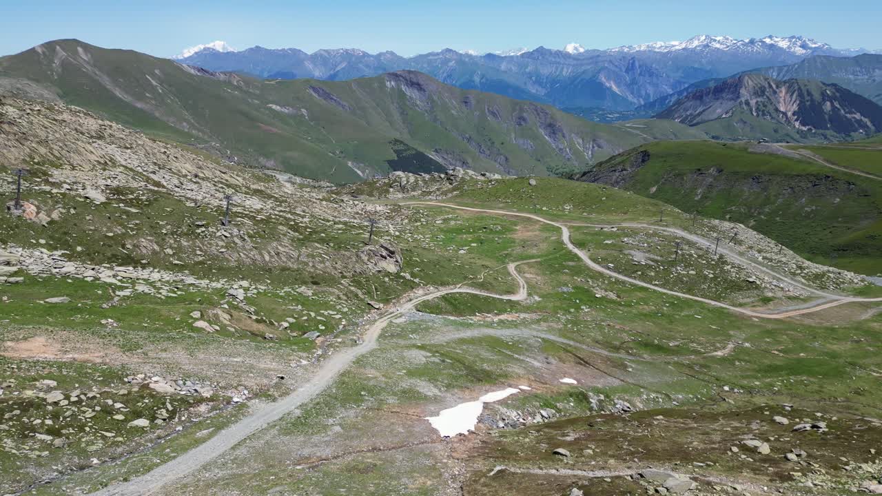 Gravel Path Hiking Trail in Ski Area in French Alps - Aerial Dolly Forward