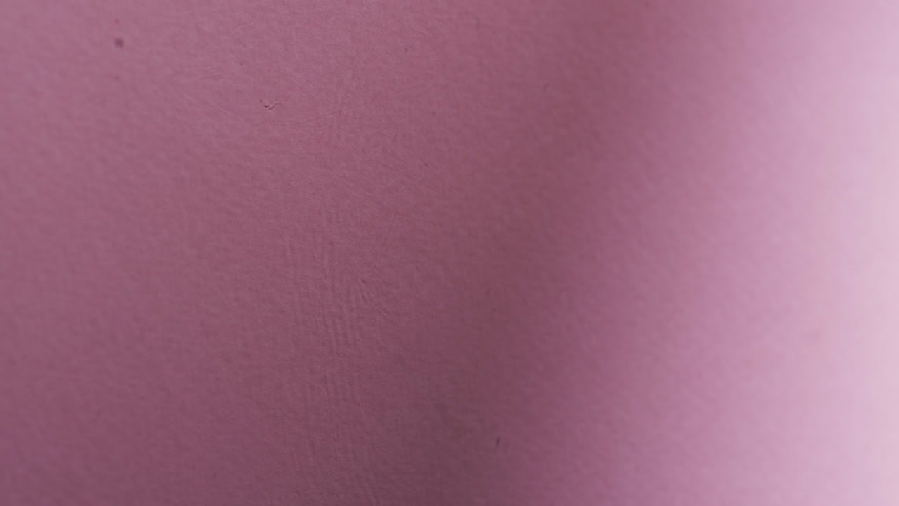 Video of close up of waves of water with copy space on pink background