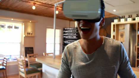 Man-using-virtual-reality-headset-in-restaurant-4k