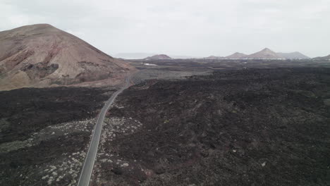Aerial-Casacoral-Road,-near-Pueblo-Tenesar-in-Lanzarote,-Canary-Islands