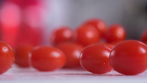 close on plum tomatoes poured onto chopping board