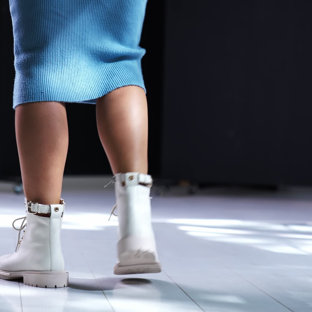 Gorgeous lady legs with fashionable shoes. Slow motion with elegant legs and footwear