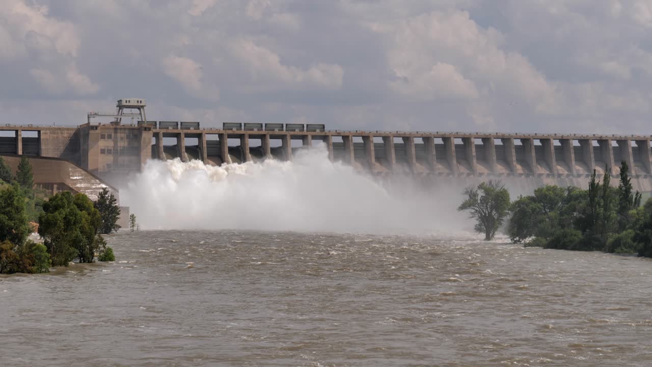 Whitewater pours from hydro dam spillways to relieve spring flooding