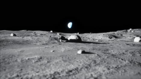 4k-high-detail-closeup-reveal-dolly-shot-of-moon-lunar-landscape-with-earth-just-above-horizon