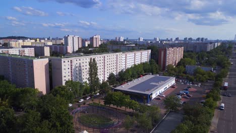 Great-aerial-top-view-flight-Large-panel-system-building-Apartment,-prefabricated-housing-complex,-Berlin-Marzahn-East-German-summer-2023