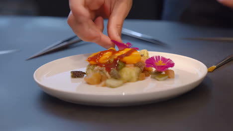 gourmet food plating with edible flowers