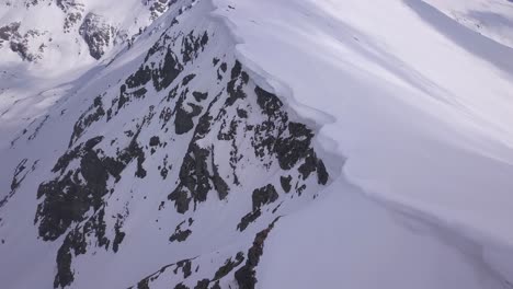 Rugged-mountain-snowy-landscape-view-from-drone