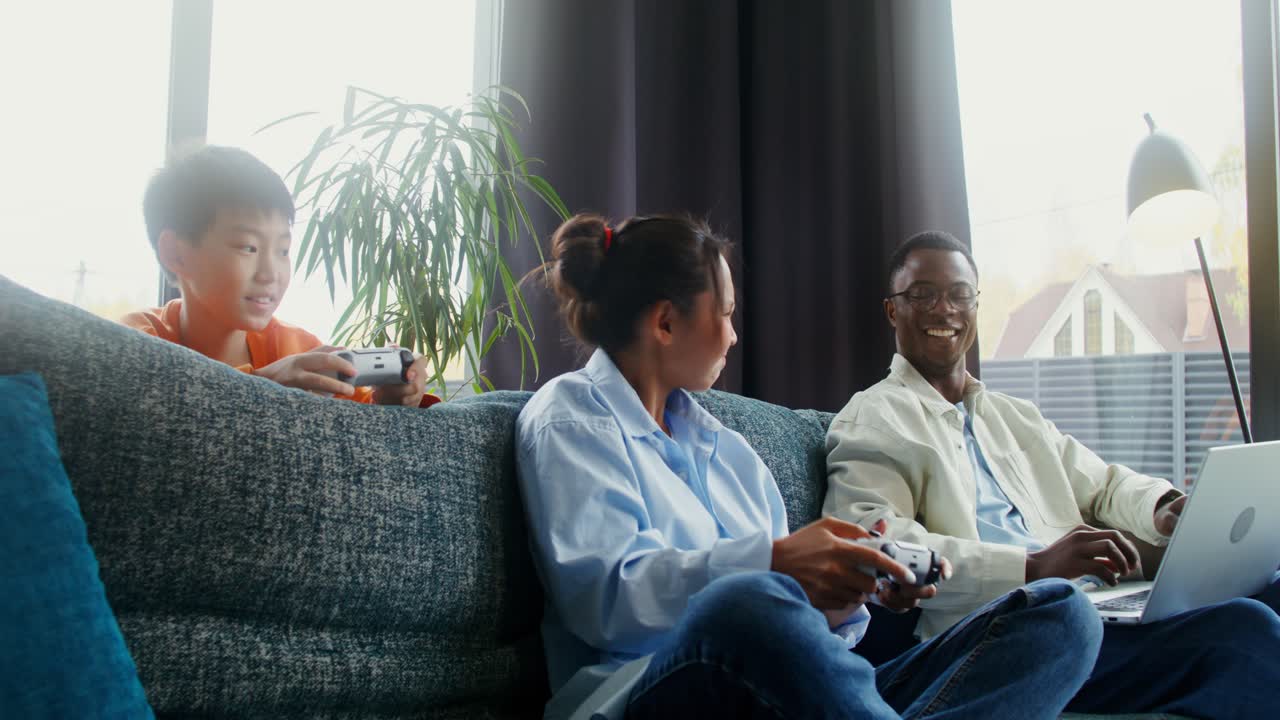 Family enjoys playing video games at home