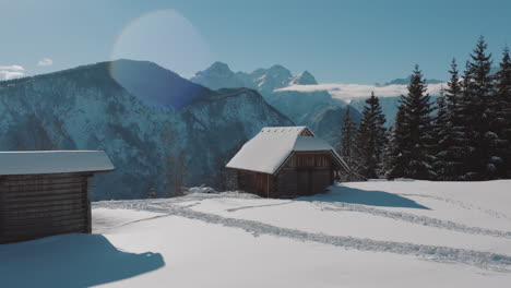 snowy alpine cabin in winter landscape
