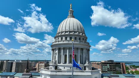 minnesota state flag waving on capitol building in front of dome