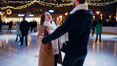 couple enjoying a romantic night of ice skating