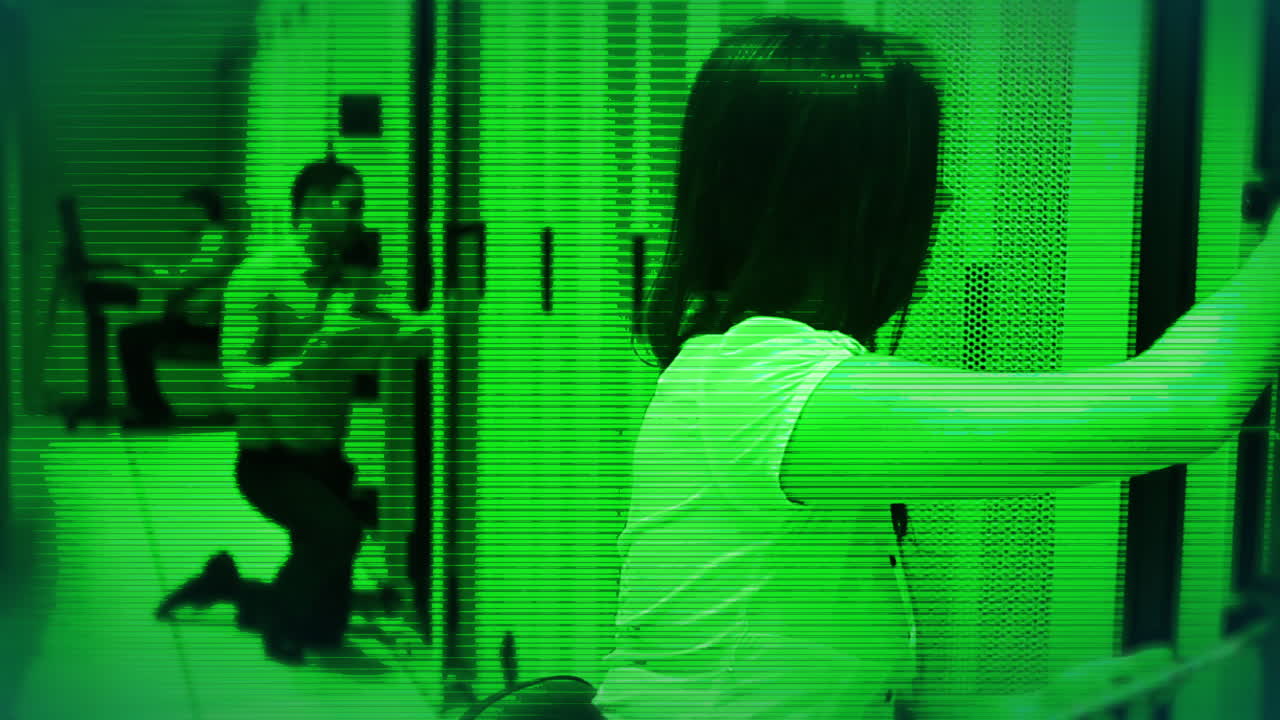 Animation of green shade over diverse workers in server room