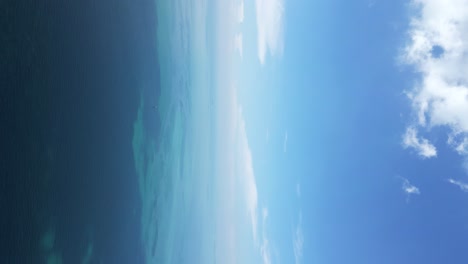 Incredible-high-above-aerial-view-over-lone-sailing-boat-in-wide-open-ocean