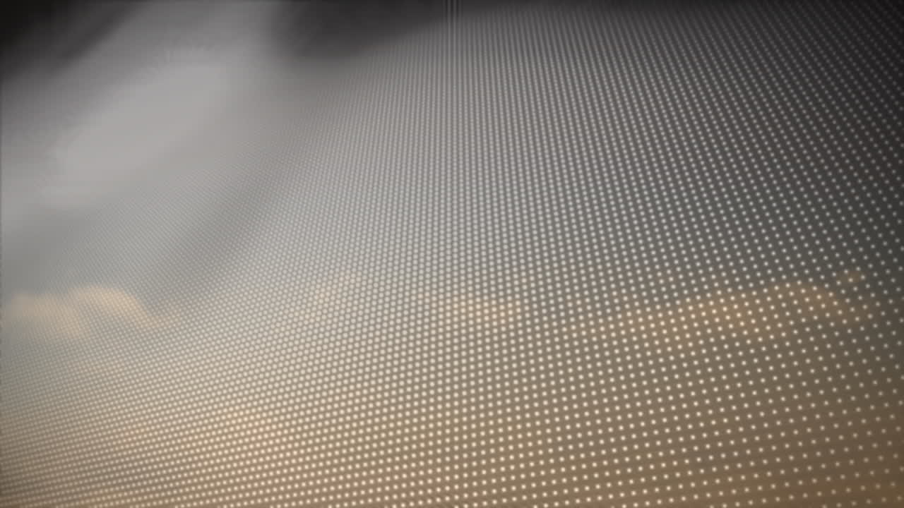 Animation of blue to yellow rows of spots over clouds in background