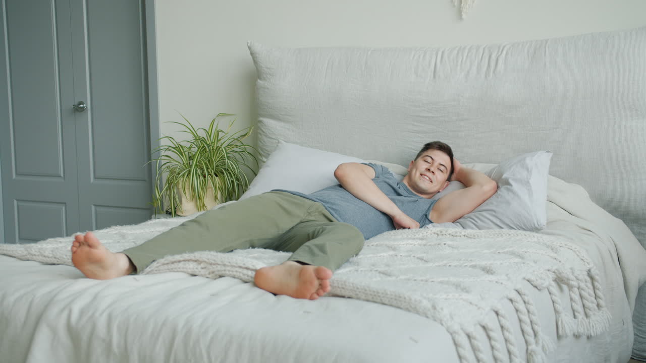Man Relaxing in Bed