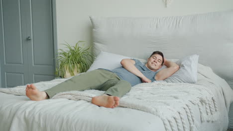 man relaxing in bed