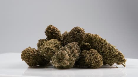many marijuana cbd buds rotating on a white background