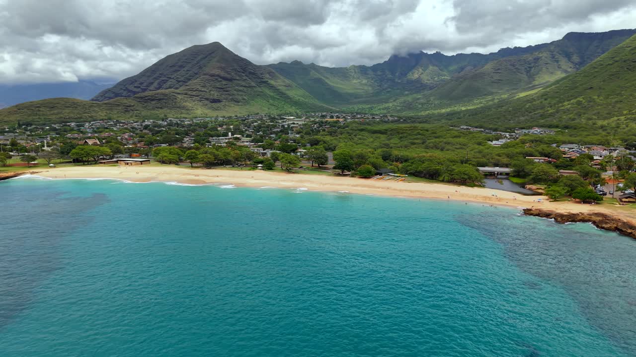 Panoramic of Nānākuli Beach Park and Waianae valley on a cloudy day, aerial