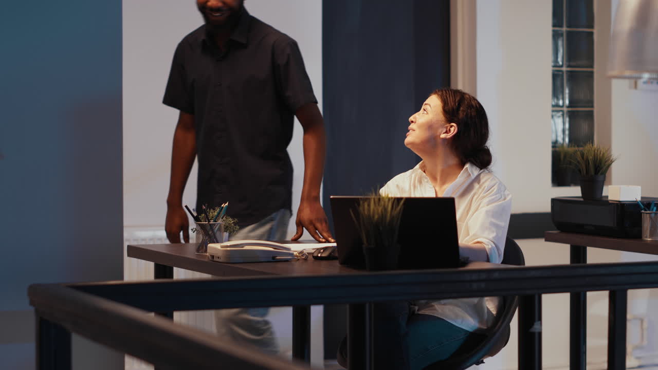 Startup employee working late at night in company office
