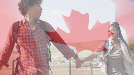 animation of flag of canada over african american couple holding hands and walking