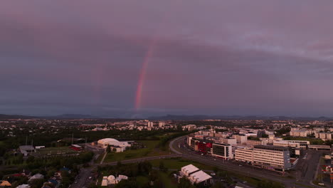 rainbow over the city in iceland reykjavik empty roads midnight sunset summer