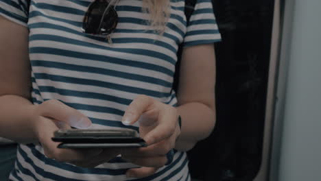 Womans-hands-with-a-smartphone