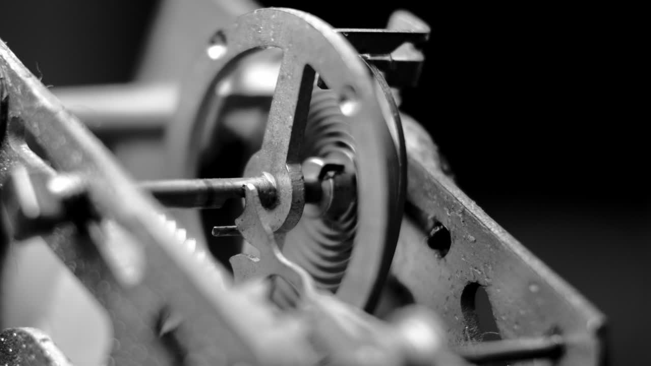Watch mechanism macro loop. Old vintage clock mechanism working, closeup shot with soft focus. Close up of a internal clock mechanism. Vintage Watch Gears Movement Macro.