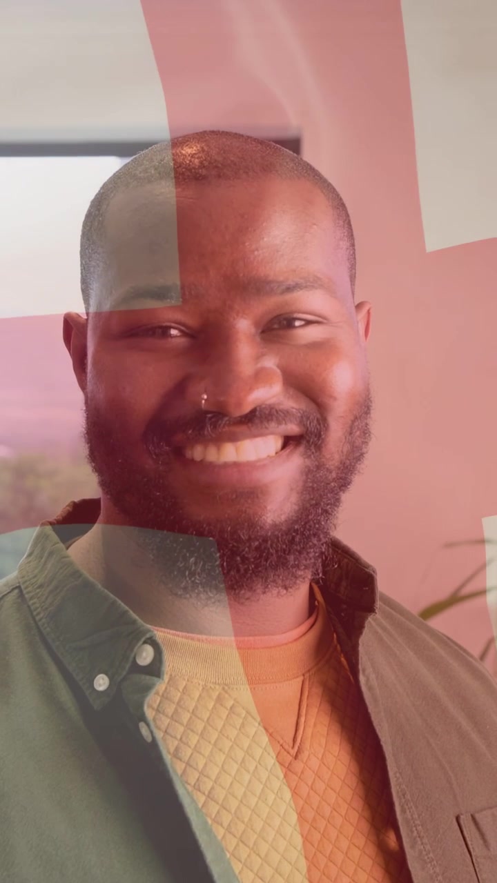 Vertical video: Man turning toward camera, graphic overlay tinting face while smiling for marketing