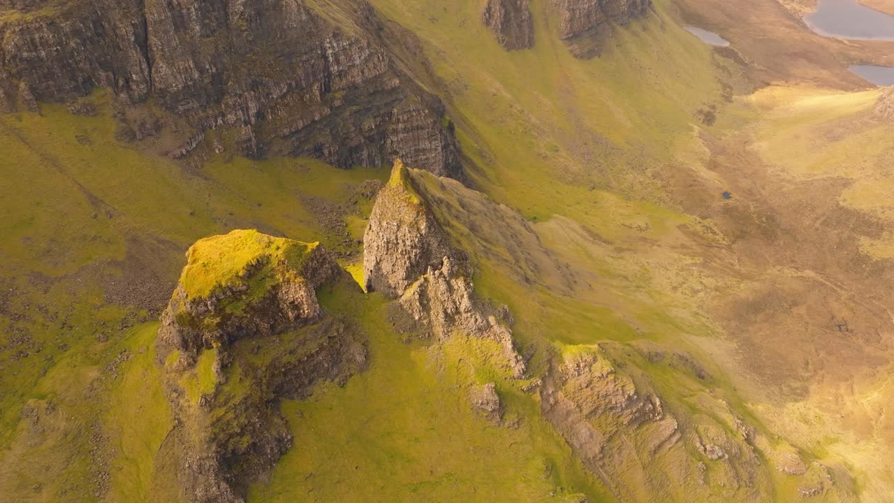Aerial drone footage of the dramatic mountain landscapes on the Isle of Skye, Scotland. Sweeping panoramic views of majestic peaks, green valleys, and wild nature. Bioda Buidhe