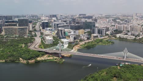 Cinematic-drone-footage-of-the-Durgam-Cheruvu-Cable-Bridge-in-Hyderabad,-India,-which-connects-Jubilee-Hills-and-Madhapur-over-the-lake
