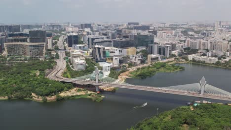 cinematic drone footage of the durgam cheruvu cable bridge in hyderabad, india, which connects jubilee hills and madhapur over the lake