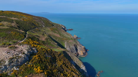hikers walk along the cliff path i howth co dublin ireland