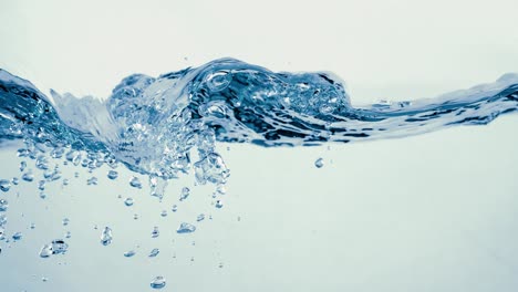 many bubbles in water close up, abstract water wave with bubbles in slow motion