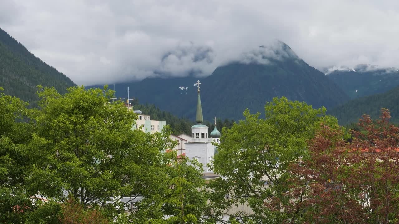 St. Michael's Cathedral, Sitka, Alaska, view from the Baranof Castle State Historic Site.Mount Verstovia covered by dense fog in the background.