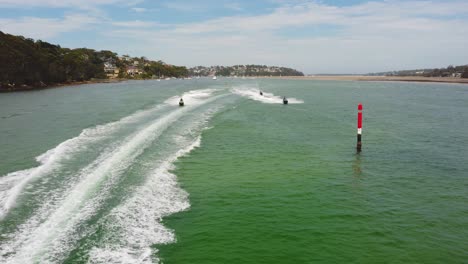 4k 30fps static shot of boats and jetskis coming towards camera