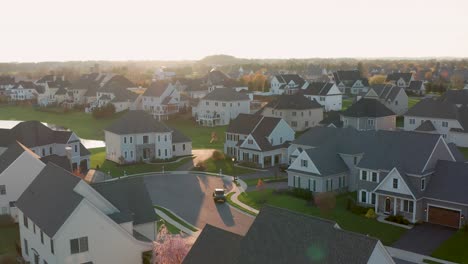 aerial of upscale homes and housing development at sunrise, sunset