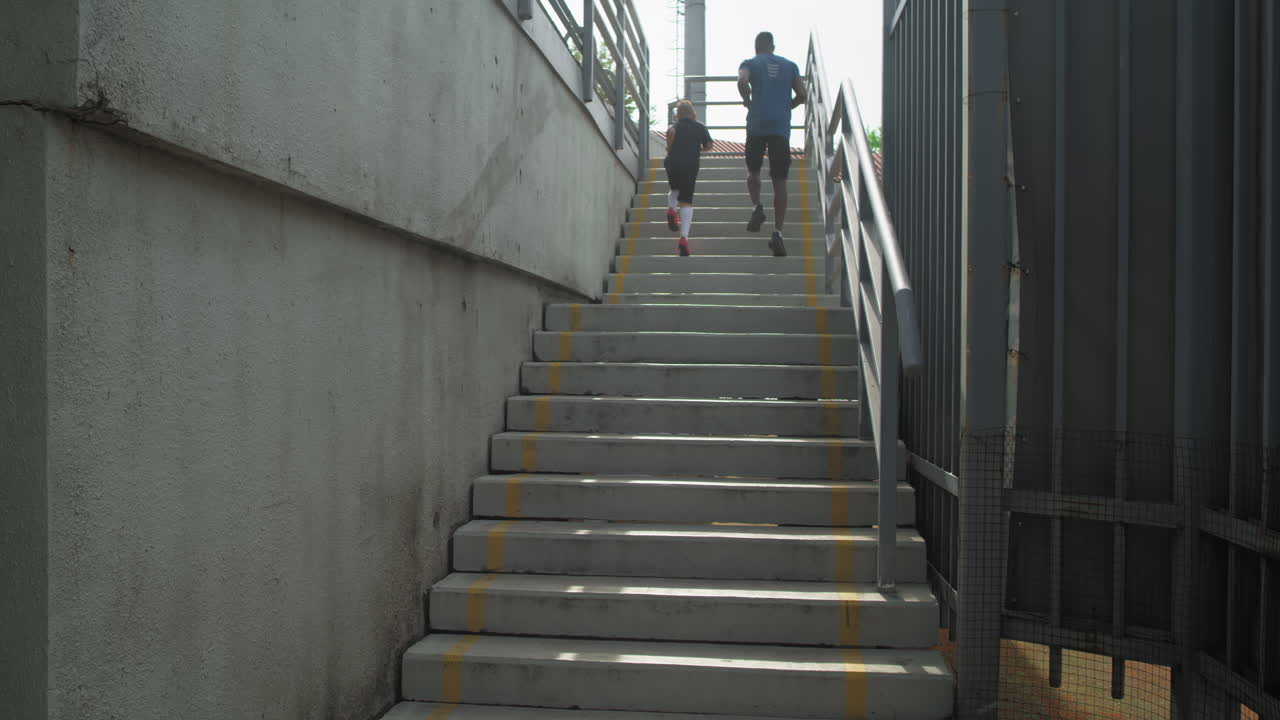 Father and Son Running Up Stairs