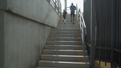 father and son running up stairs