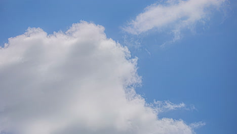 blue sky with moving thick stormy clouds. timelapse