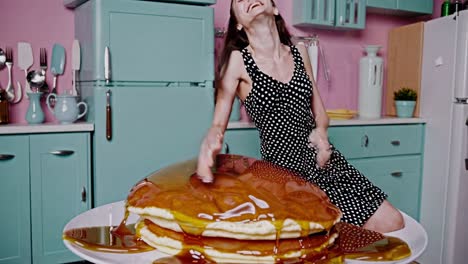 woman enjoying a huge stack of pancakes