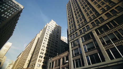 Moving-looking-up-pov-drone-shot-of-NYC-New-York-City-Manhattan-modern-skyscraper-high-rises