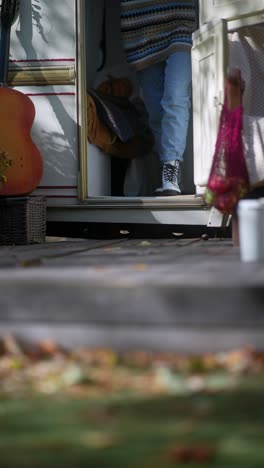 woman entering a camper van