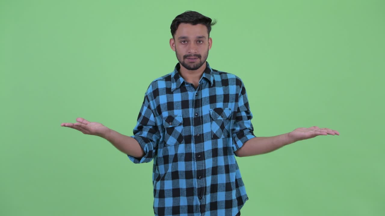 Young handsome bearded Persian hipster man