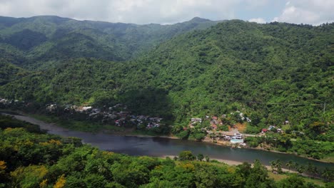 Riverside-Town-At-The-Foot-Of-Green-Mountain-In-Catanduanes,-Philippines