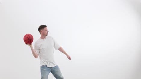 man throwing a basketball on a white background