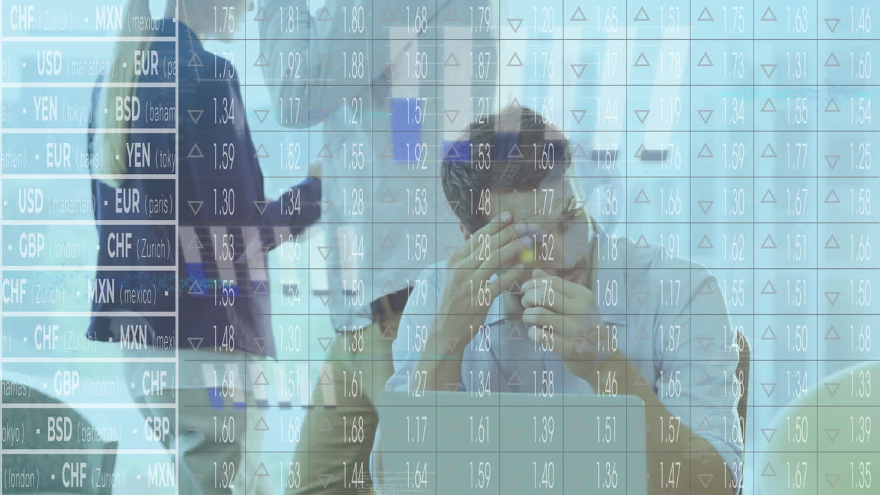 Analyzing financial data, businessman stressed with currency exchange rates in office